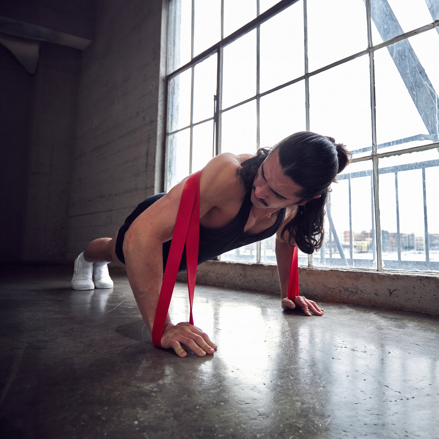 Woman using a resistance band for an upper body workout